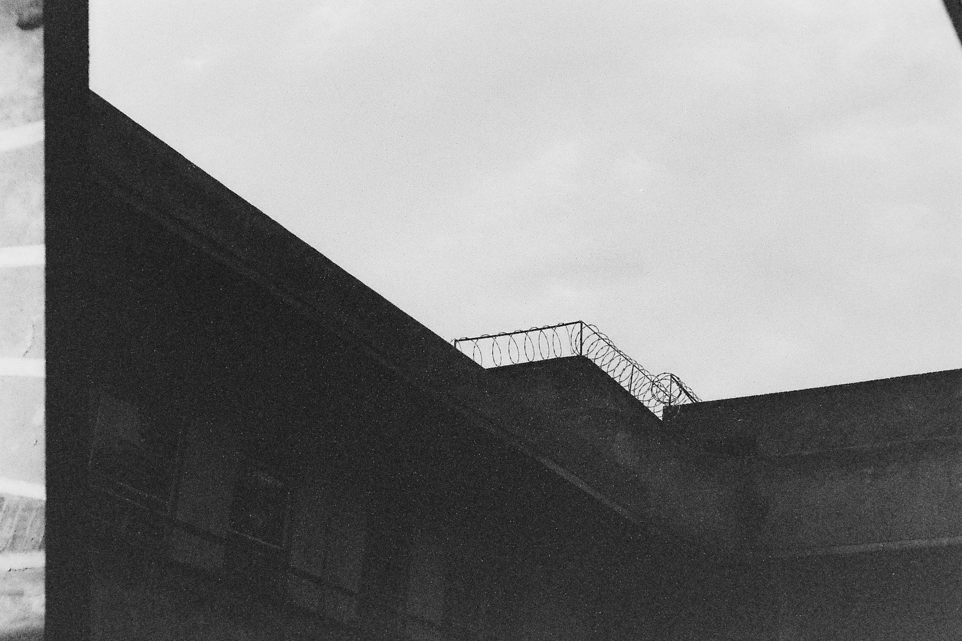 Barbed wire above house