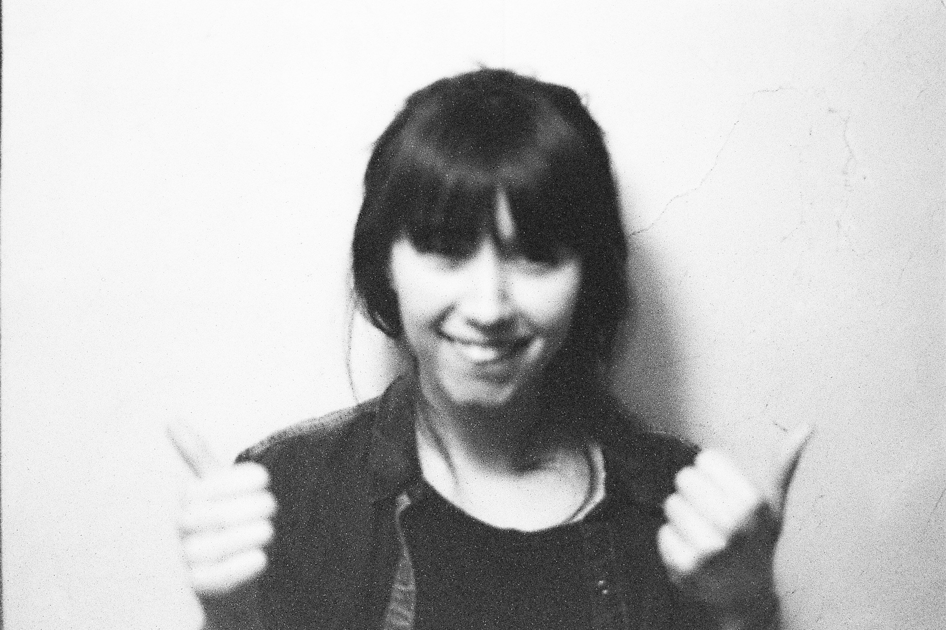 spanish woman in front of a wall