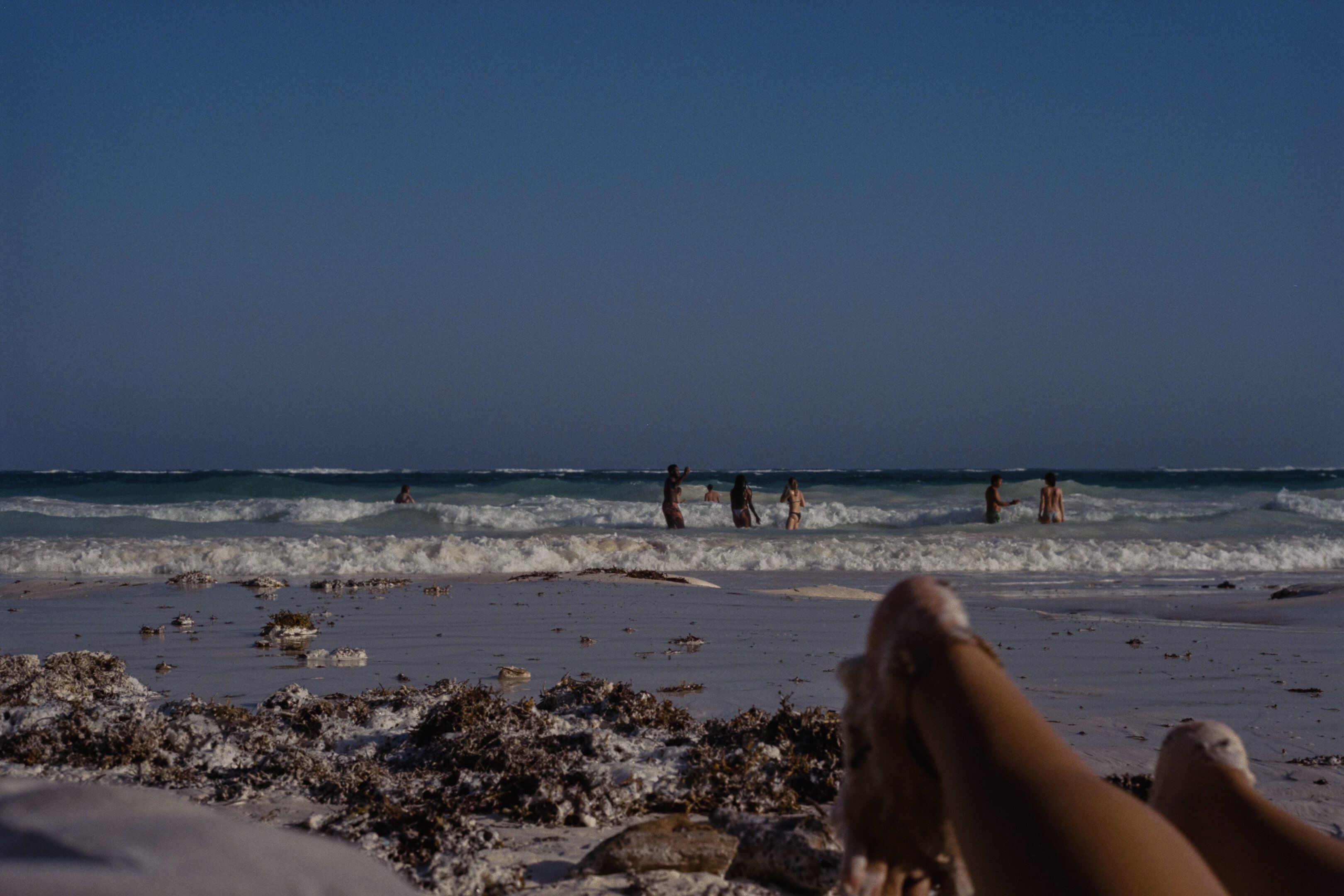 Tulum beach with feet and a view onto the beach